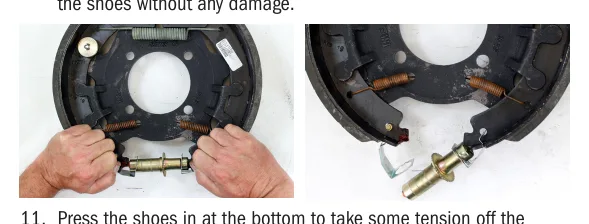 Spreading the brake shoes to remove the adjusting screw assembly and pivot the silver adjuster retainer clips downward.